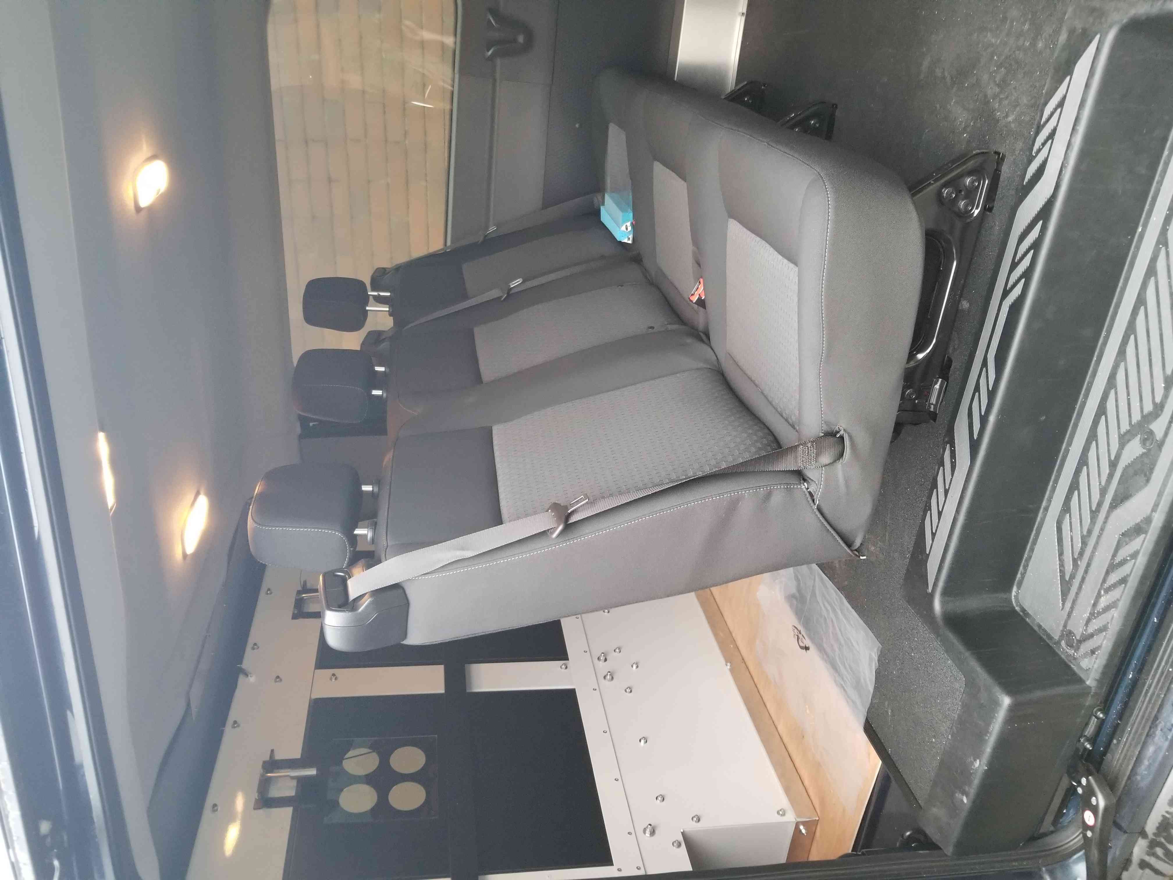Photo of the rear passenger seats inside a CSC prisoner transport vehicle.
