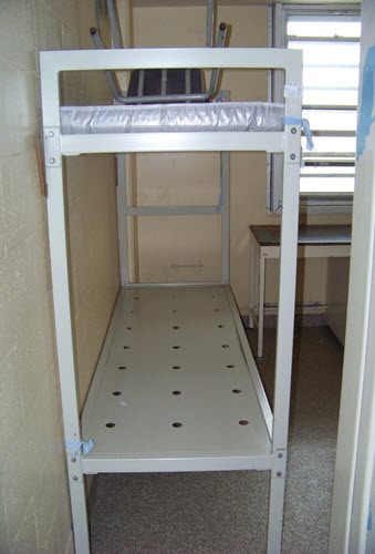 A picture of a bunk bed (without a ladder) used when inmates are double bunked.